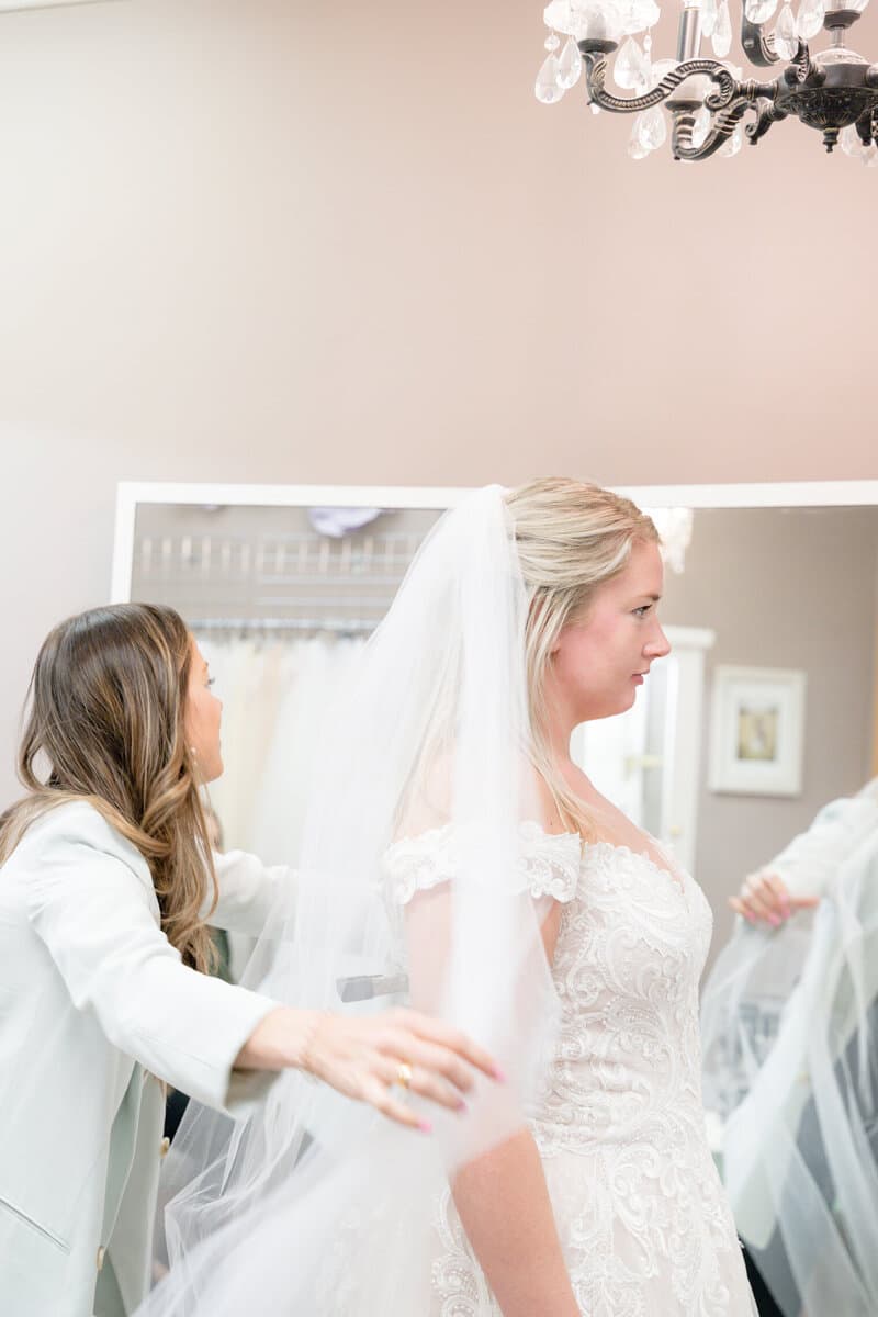 Bride trying on dress